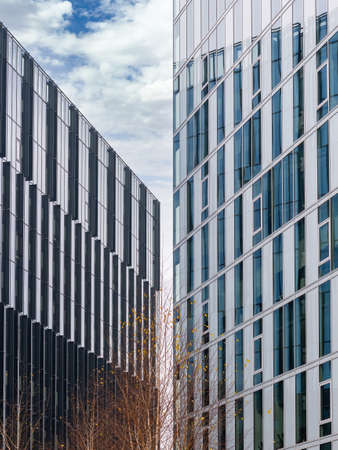 Modern glass office building against the clear blue sky. Abstract photographyの写真素材