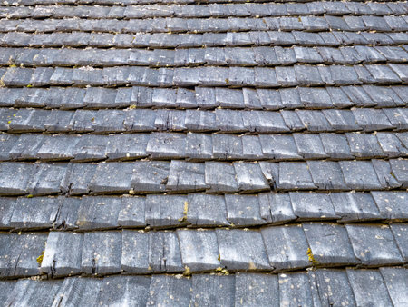 Old rustic wooden roof tiles background texture.の写真素材