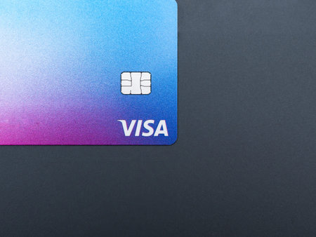 Bucharest, Romania - 03.25.2022: Visa credit or debit card on grey background. Online electronic commerce conceptのeditorial素材
