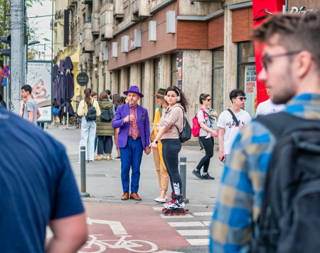 Bucharest, Romania - 04.08.2022: Elegant dressed tourists and locals having fun in the center of Bucharestのeditorial素材