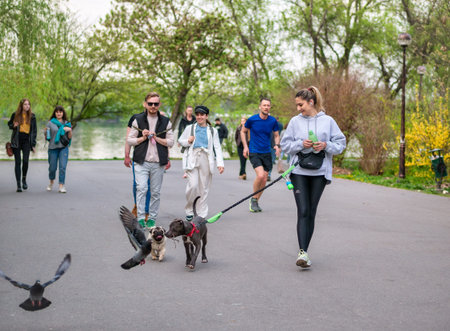 Bucharest, Romania - 04.15.2022: Busy weekend with many tourists and locals out for a stroll in King...