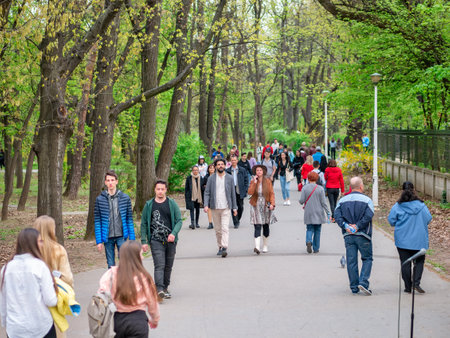 Bucharest, Romania - 04.15.2022: Busy weekend with many tourists and locals out for a stroll in King Mihai I park (Herestrau)のeditorial素材