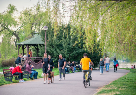 Bucharest, Romania - 04.15.2022: Busy weekend with many tourists and locals out for a stroll in King Mihai I park (Herestrau)のeditorial素材