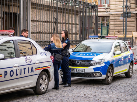 Bucharest, Romania - 04.08.2022: Female police officers in the old town center of Bucharestのeditorial素材