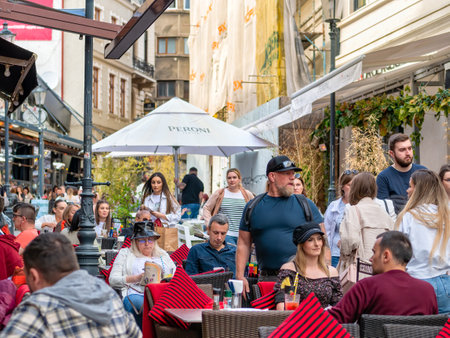 Bucharest, Romania - 04.08.2022: Busy weekend day with many people on the streets of old town center in Bucharest.のeditorial素材