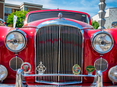 Bucharest, Romania - 05.20.2022: Front view with a red vinatge Jaguar MK IX.のeditorial素材