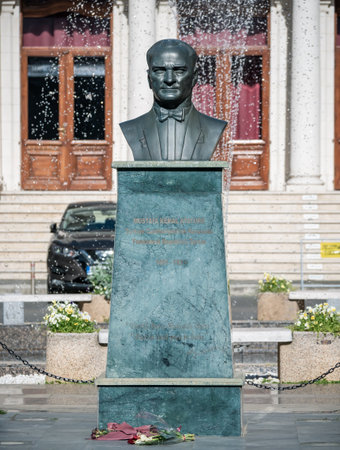 Bucharest, Romania - April 2022: The Bust of Mustafa Kemal Atatrk in front of the Odeon Theatre. Cultural bulding in the center of Bucharest.のeditorial素材