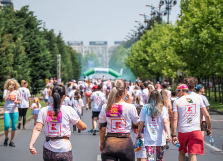 Bucharest, Romania - April 2022: Many people taking part in the Color Run race in Bucharest. Famous paint race sponsored by Kauflandのeditorial素材
