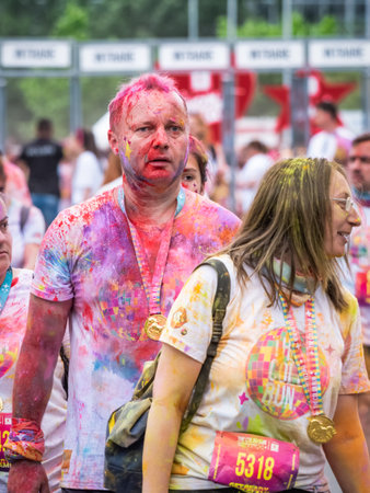 Bucharest, Romania - April 2022: Many people taking part in the Color Run race in Bucharest. Famous paint race sponsored by Kauflandのeditorial素材
