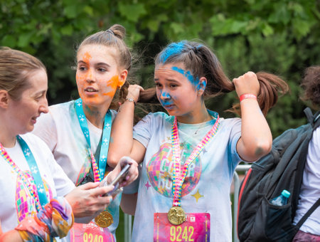 Bucharest, Romania - April 2022: Many people taking part in the Color Run race in Bucharest. Famous paint race sponsored by Kauflandのeditorial素材