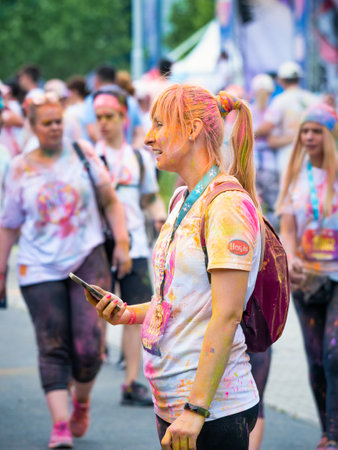 Bucharest, Romania - April 2022: Many people taking part in the Color Run race in Bucharest. Famous paint race sponsored by Kauflandのeditorial素材