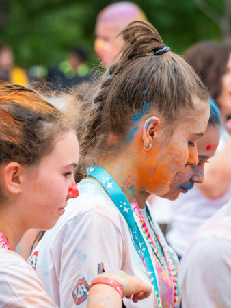 Bucharest, Romania - April 2022: Many people taking part in the Color Run race in Bucharest. Famous...