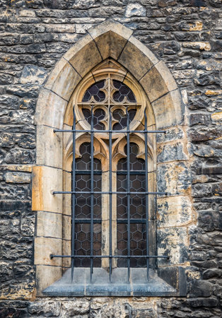 Architectural detail with a window of a church built in gothic medieval styleの写真素材