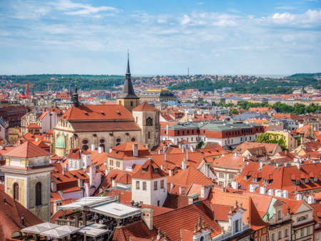 Prague, Czech Republic - June 2022: Beautiful aerial view with the city of Prague. Many traditional houses with red roof tiles.の写真素材