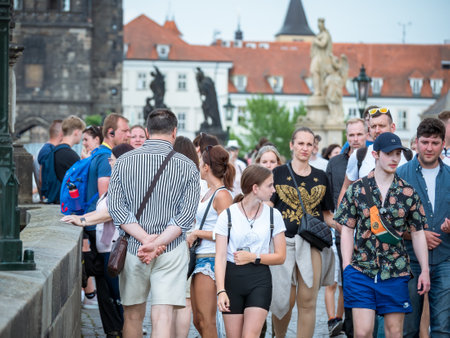 Prague, Czech Republic - June 2022: Crowds of tourist people walking and strolling on the famous Charles Bridge in Prague.のeditorial素材