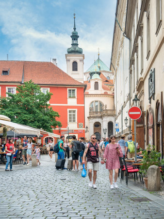 Prague, Czech Republic - June 2022: Pedestrian cobblestone street with outdoor restaurants and cafe in the center of Pragueのeditorial素材