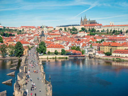 Prague, Czech Republic - June 2022: View from above with the Charles Bridge main touristic attraction with the Prague Castle in the backgroundの写真素材
