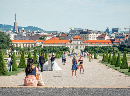Vienna, Austria - June 2022: Tourists strolling on the alleys of the gardens of Belvedere Palace (Schloss Belvedere)のeditorial素材