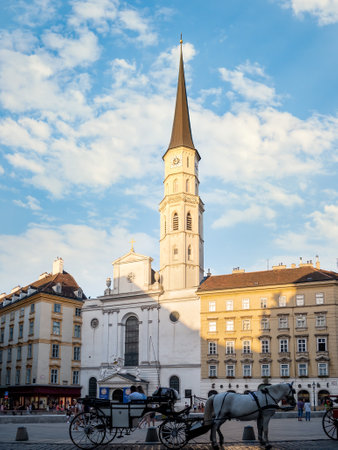 View with Saint Michael's Catholic Church (Michaelerkirche) located at Michaelerplatzのeditorial素材