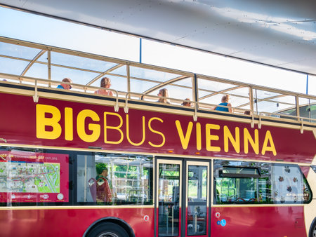 Vienna, Austria - June 2022: Big Buss Vienna Hop-On Hop-Off Tours in trafficのeditorial素材