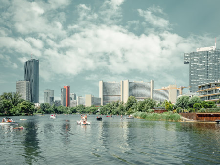 Vienna, Austria - June 2022: View from Kaiserwasser Alte Donau park with the building complex hosting the United Nations Office at Viennaのeditorial素材