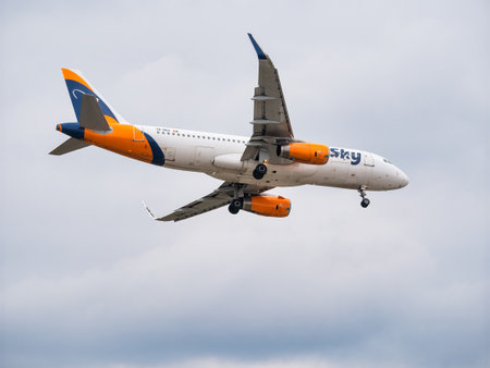 Bucharest, Romania - September 2022:HiSky Airways Airbus A320-200 flying against blue sky. Airplane takes off from Henry Coanda International Airport.のeditorial素材
