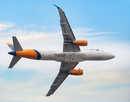 Bucharest, Romania - September 2022:HiSky Airways Airbus A320-200 flying against blue sky. Airplane takes off from Henry Coanda International Airport.のeditorial素材