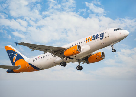Bucharest, Romania - September 2022: HiSky Airways Airbus A320-200 flying against blue sky. Airplane takes off from Henry Coanda International Airport.のeditorial素材