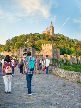 Veliko Tarnovo, Bulgaria - August 2022: Tourists in Veliko Tarnovo and the Eastern Orthodox Ascension Cathedral located in the famous medieval fortress Tsarevets in the background.のeditorial素材