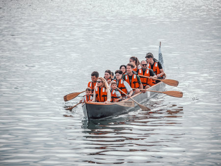 Bucharest, Romania - 09.30.2022: Many people in a canoe paddling. Kayak on Dambovita lake in Bucharest.のeditorial素材