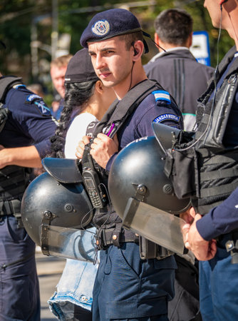 Bucharest, Romania - October 2022: : Police officers and Gendarmerie or military police closely supervising the demonstrators at a protest in Bucharest.のeditorial素材