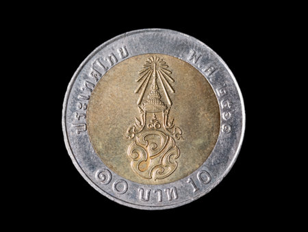 Macro detail with a 10 Thai Baht coin. The baht is the official currency of Thailandの写真素材