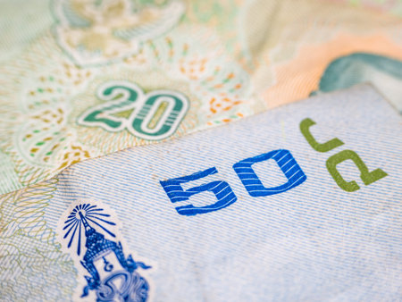 Macro detail with a 50 Thai Baht banknote. the baht is the official currency of Thailand