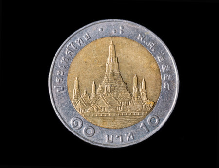 Macro detail with a 10 Thai Baht coin. The baht is the official currency of Thailandの写真素材