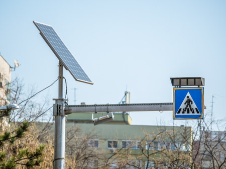 Zebra crossing sign or pedestrian crossing traffic sign powered by a photovoltaic solar panel.の写真素材