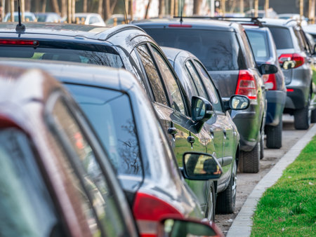 Many cars parked on the sidewalk and street in Bucharest, Romania.の写真素材