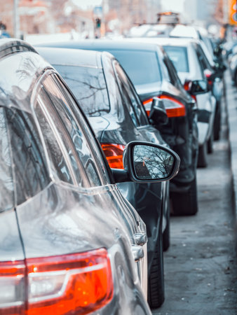 Many cars parked on the sidewalk and street in Bucharest, Romania.の写真素材