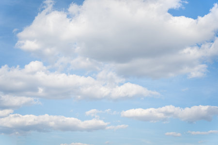 White clouds on a blue sky background.の写真素材