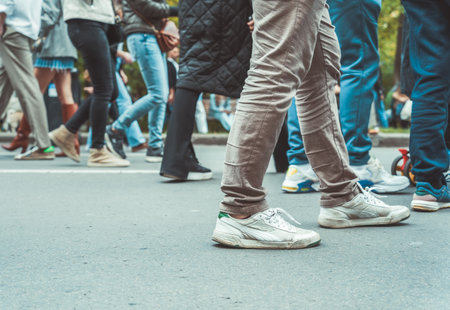 Close up with many people's feet walking on the streetの写真素材