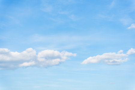White clouds on a blue sky background.の写真素材