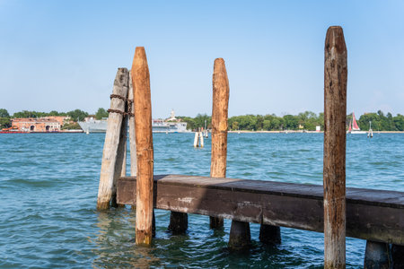 A wooden mooring pier and mooring piles on the Grand Canal in Venice, Italy.の写真素材