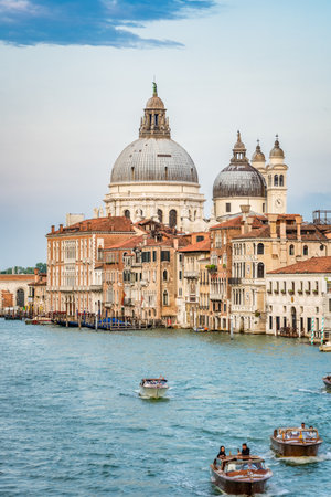 Venice, Italy - May 29 2023: View over the Grand Canal with Basilica di Santa Maria della Salute in Venice.のeditorial素材