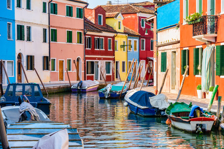 Colorful houses along the water canal in the island of Burano, Venice.の写真素材