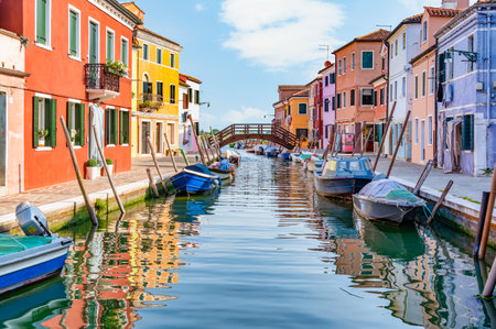 Colorful houses along the water canal in the island of Burano, Venice.の写真素材