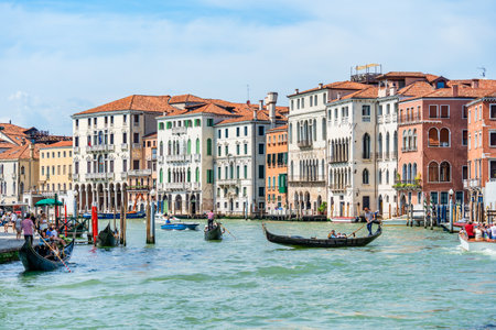 Venice, Italy - May 30 2023: Traditional gondola ride on the Grand Canal.Tourists in Venice.のeditorial素材