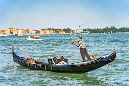 Venice, Italy - May 30 2023: Traditional gondola ride on the Grand Canal.Tourists in Venice.のeditorial素材