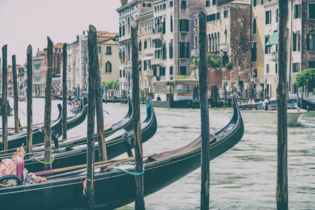 Venice, Italy - May 30 2023: Traditional gondola ride on the Grand Canal near Rialto Bridge (Ponte di Rialto). Tourists in Venice.のeditorial素材