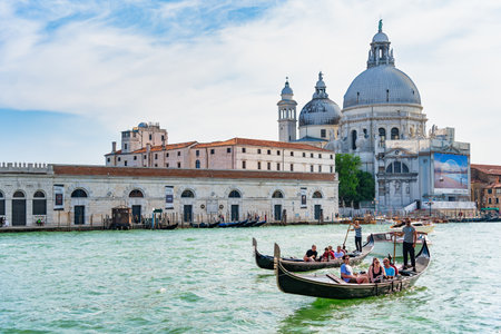 Venice, Italy - May 30 2023: Traditional gondola ride on the Grand Canal.Tourists in Venice.のeditorial素材