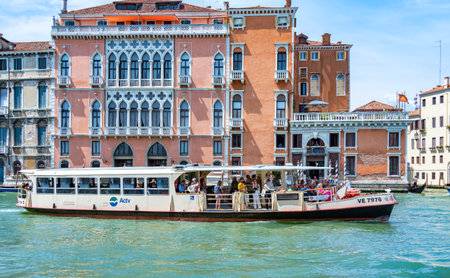 Venice, Italy - May 29 2023: Crowded public venetian public waterbus called vaporetto (ACTV) on Grand Canal in Veniceのeditorial素材