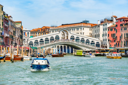 Venice, Italy - May 30 2023: Intense water traffic on Grand Canal near Rialto Bridge in Venice.のeditorial素材
